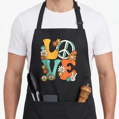 Tablier de cuisine noir avec illustration Love 60's 70's Party Costume colorée et style hippie rétro.