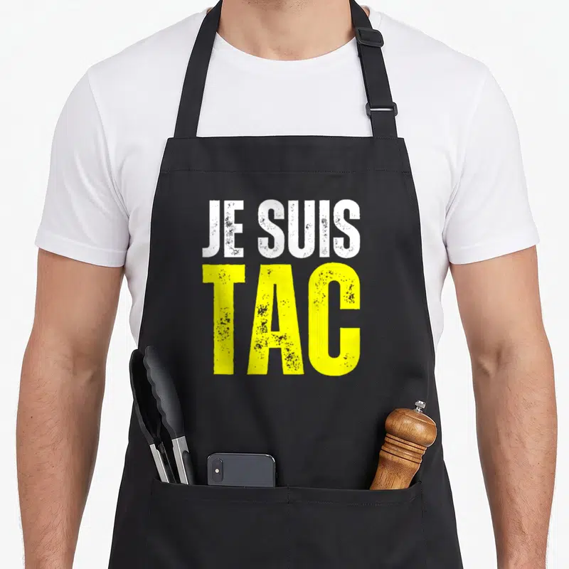 Tablier de cuisine noir avec inscription Je Suis Tac en blanc et jaune style graffiti.
