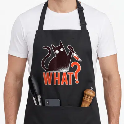 Tablier de cuisine noir avec un chat noir tenant un couteau ensanglanté et le texte WHAT? en orange.