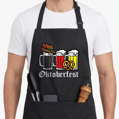 Tablier de cuisine noir avec illustration de trois tasses de bière, chapeau bavarois et pretzel sous le mot Oktoberfest.