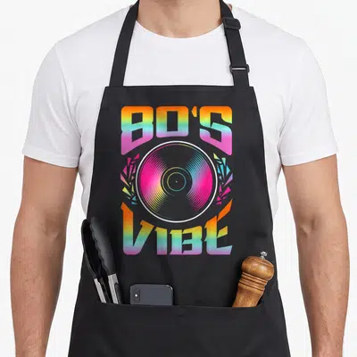 Tablier de cuisine noir avec illustration 80's Vibé et disque vinyl aux couleurs arc-en-ciel.