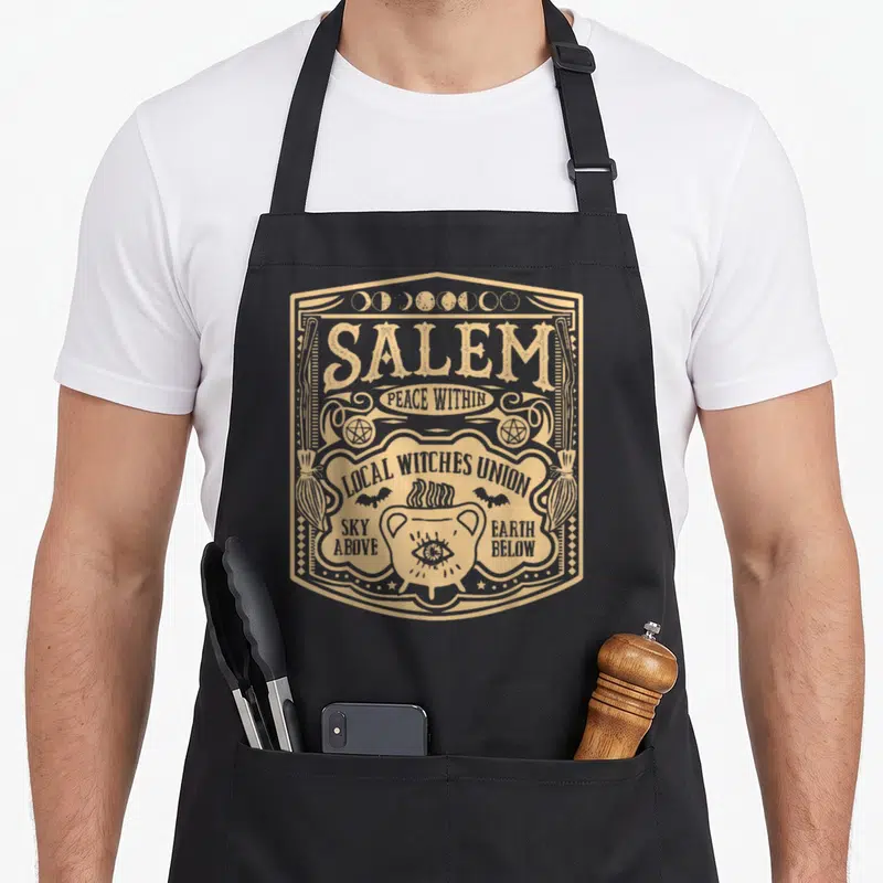 Tablier de cuisine noir avec illustration vintage Salem Local Witches Union et cauldron mystique doré