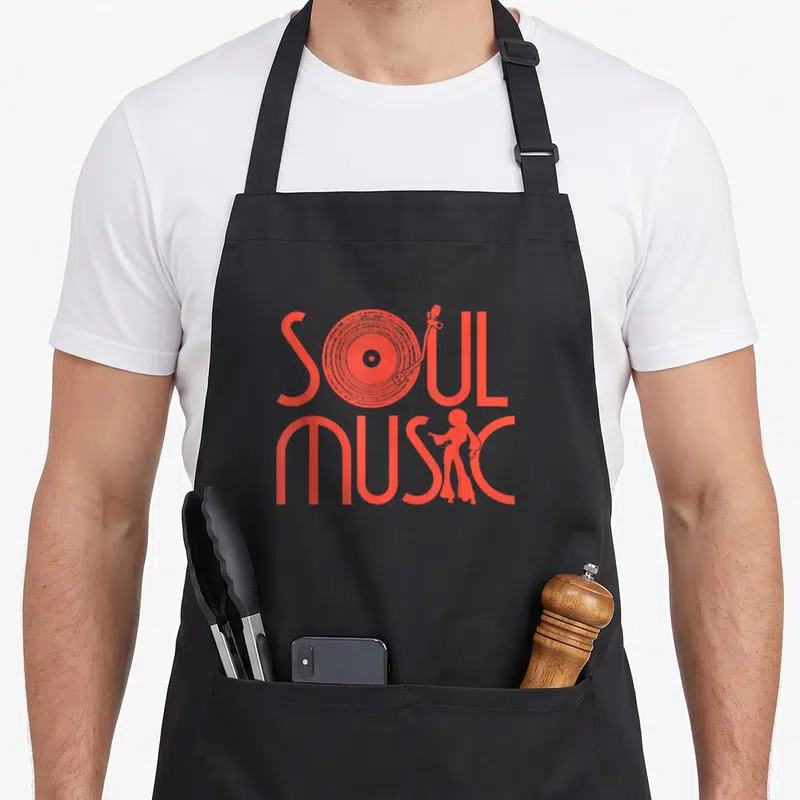Tablier de cuisine noir avec motif rouge soul music plateau tournant et silhouettes dans un style vintage 70s.
