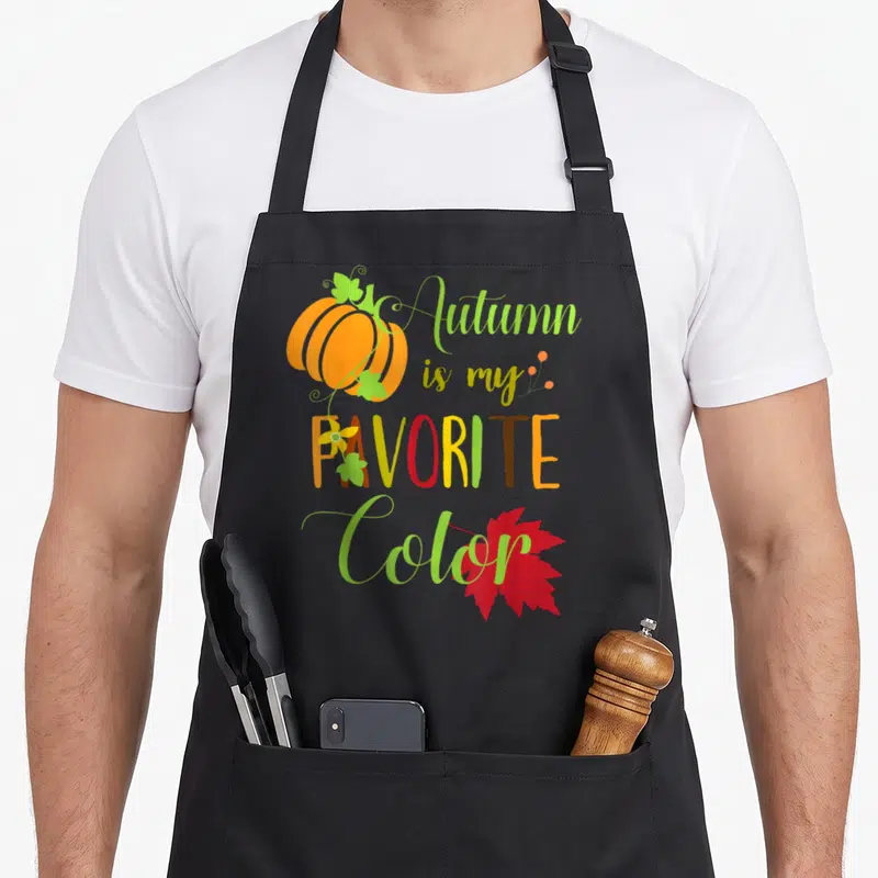 Tablier de cuisine noir avec Autumn Is My Favorite Color, citrouille orange et feuille d'érable rouge imprimés.