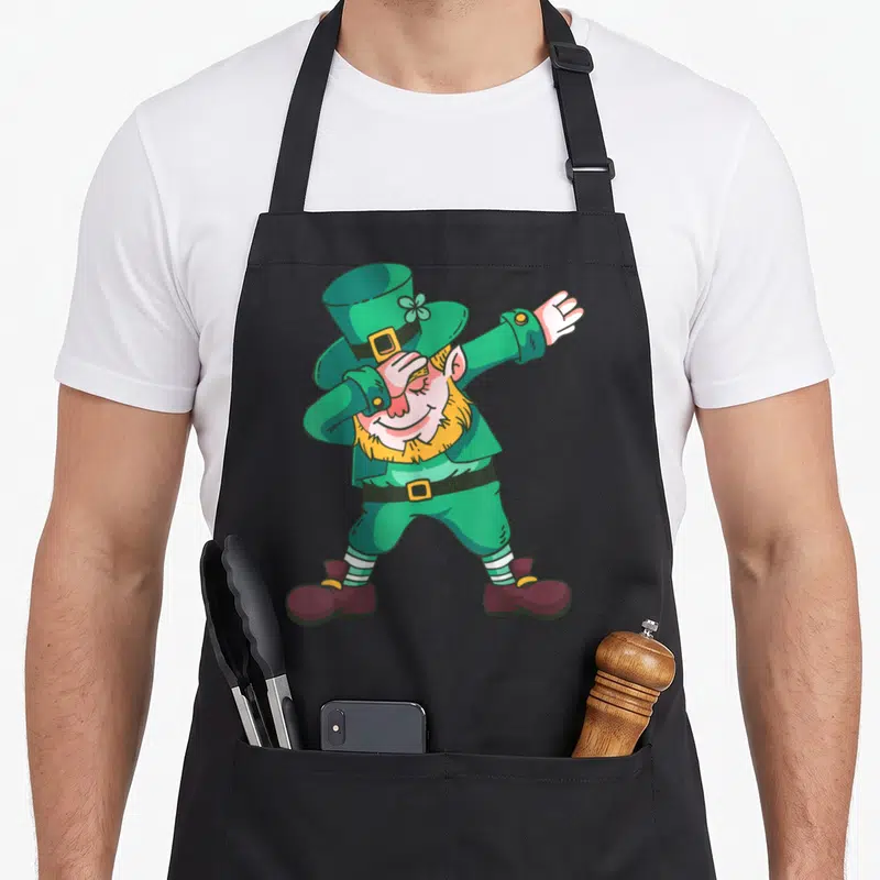 Tablier de cuisine noir avec illustration d'un lutin vert effectuant la pose dab.