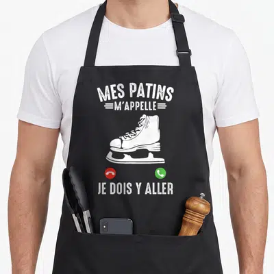 Tablier de cuisine noir avec une patin blanche et le texte Mes Patins M'appelle Je dois y aller.