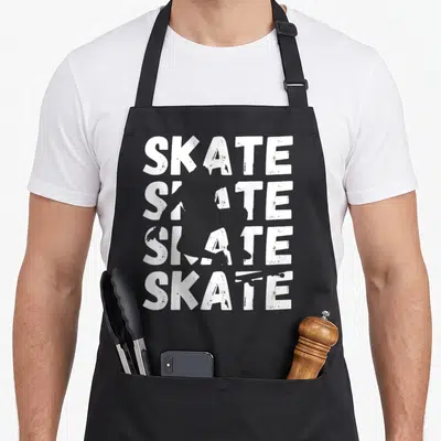 Tablier de cuisine noir avec le texte Skate écrit quatre fois en blanc avec effet dégradé et usé.