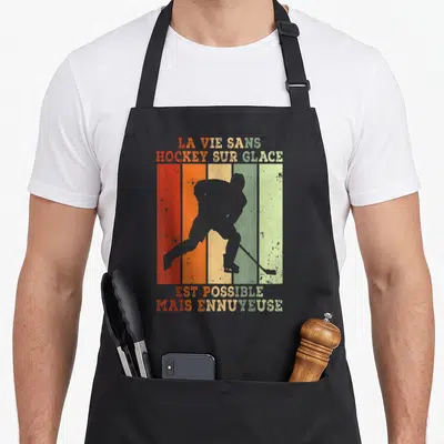 Tablier de cuisine noir avec silhouette de joueur de hockey sur fond de bandes colorées style rétro.