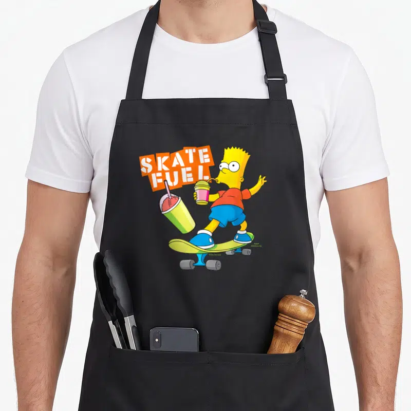 Tablier de cuisine noir avec Bart Simpson sur skateboard tenant un squishee et le texte Skate Fuel orange.