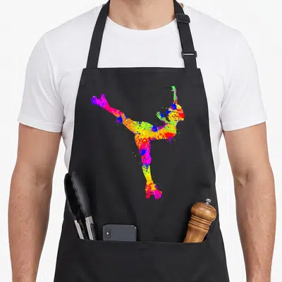 Tablier de cuisine noir avec une patineuse aux roller skates formée par des éclaboussures de peinture multicolore vibrante.