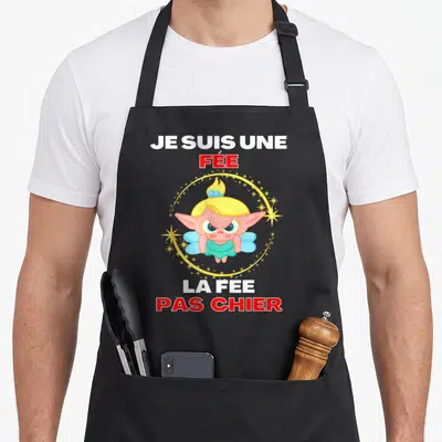 Tablier de cuisine noir avec illustration d'une fée rose aux cheveux blonds et texte Je suis une fée la fée pas chier.