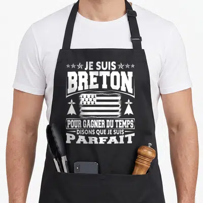 Tablier de cuisine noir avec linscription Je suis Breton pour gagner du tempsson que je suis parfait en blanc.