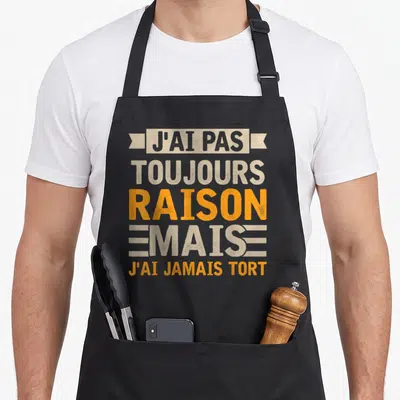 Tablier de cuisine noir avec inscription typographique J'ai pas toujours raison mais j'ai jamais tort en orange et beige.