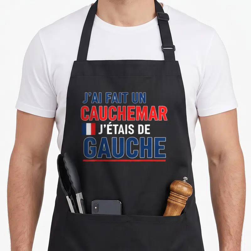 Tablier de cuisine noir avec inscription J'ai fait un cauchemar j'étais de gauche et petit drapeau tricolore.