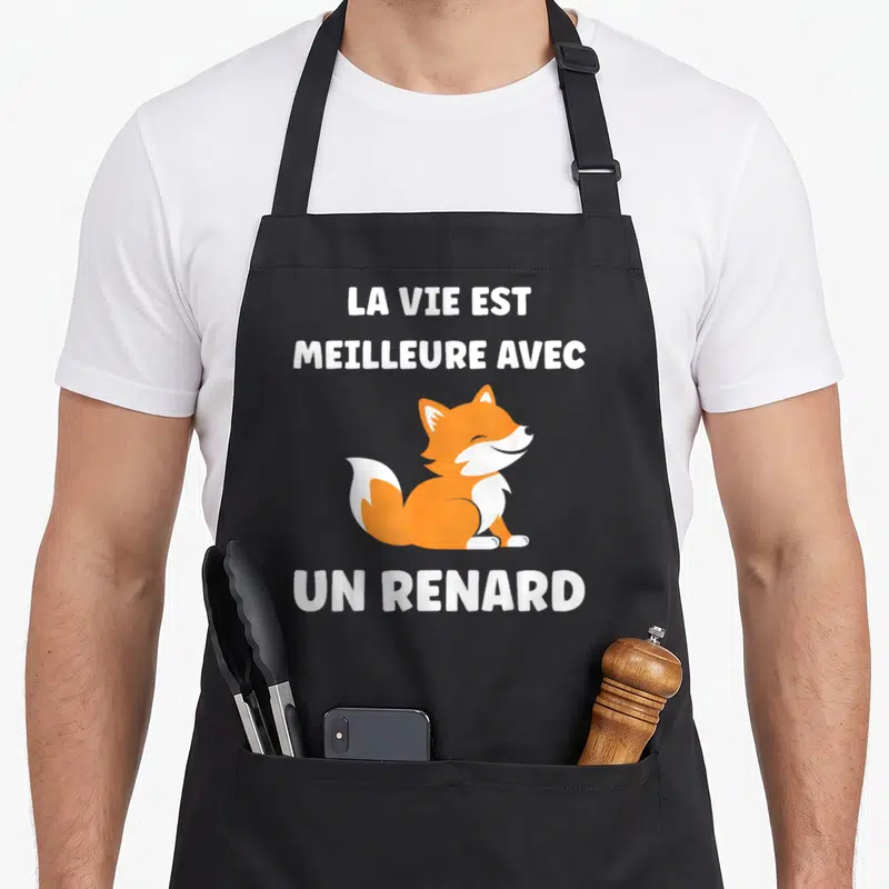Tablier de cuisine noir avec illustration d'un renard souriant orange et blanc et texte blanc La vie est meilleure avec un renard