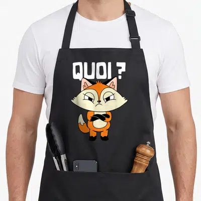 Tablier de cuisine noir avec illustration d'un renard orange aux bras croisés et le texte Quoi ?