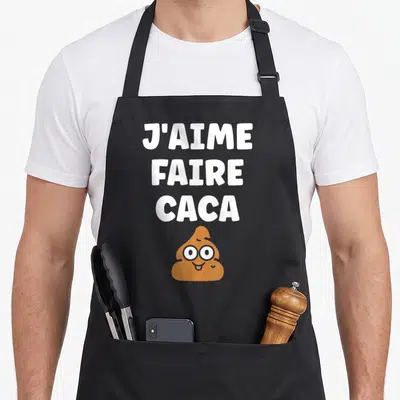 Tablier de cuisine noir avec texte blanc J'aime faire caca et dessin de fèces marron aux yeux ronds