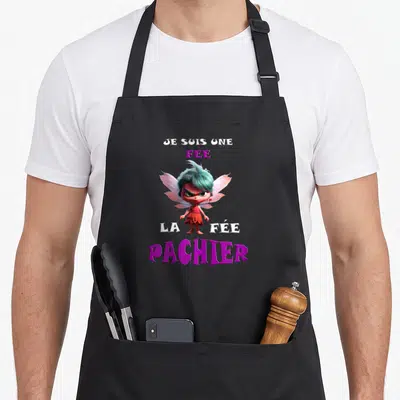 Tablier de cuisine noir avec illustration d'une fée aux cheveux bleus et ailes roses, accompagnée du texte Je suis une fée la fée pachier en lettres blanches et violettes.