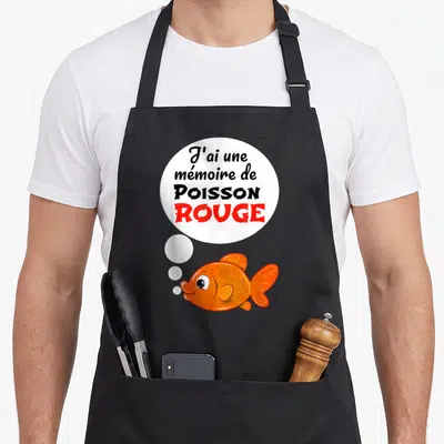 Tablier de cuisine noir avec un poisson rouge orange et la phrase J'ai une mémoire de poisson rouge dans une bulle blanche.
