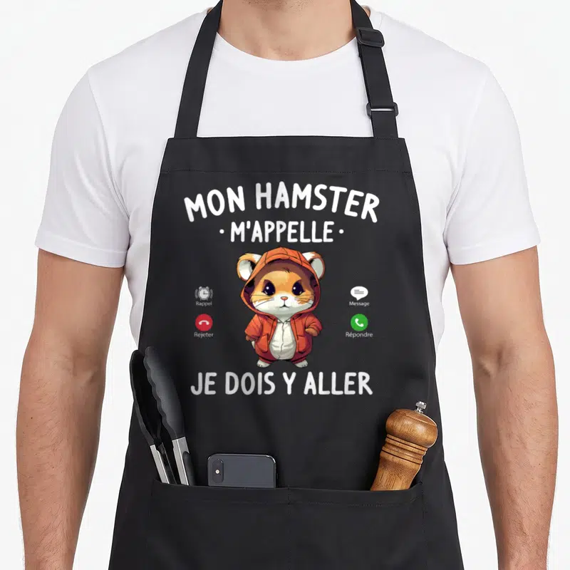 Tablier de cuisine noir avec illustration d'un hamster en survêtement orange imitant une interface de téléphone mobile.