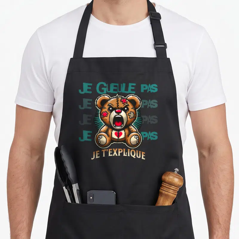 Tablier de cuisine noir avec illustration d'un ours enragé et du texte je gueule pas je t'explique