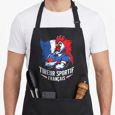Tablier de cuisine noir avec illustration d'un coq gaulois en tenue bleue et le texte tireur sportif français.