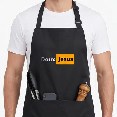 Tablier de cuisine noir avec inscription Doux Jésus en blanc et texte Jesus dans un rectangle orange.