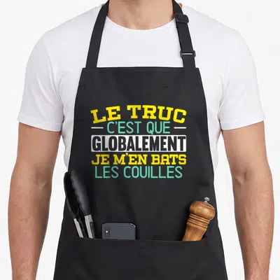 Tablier de cuisine noir avec inscription le truc c'est que globalement je m'en bats les couilles en jaune et vert.