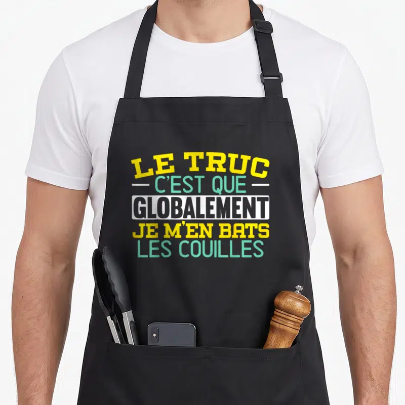 Tablier de cuisine noir avec inscription le truc c'est que globalement je m'en bats les couilles en jaune et vert.