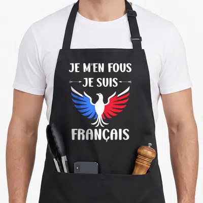 Tablier de cuisine noir avec inscription Je m'en fous je suis Français et aigle aux ailes bleue et rouge.