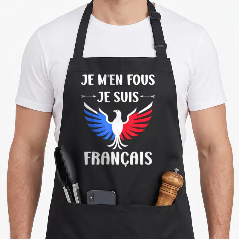 Tablier de cuisine noir avec inscription Je m'en fous je suis Français et aigle aux ailes bleue et rouge.