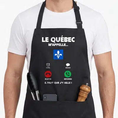 Tablier de cuisine noir avec illustration écran de téléphone affichant le drapeau du Québec et le texte Il faut que j'y aille.