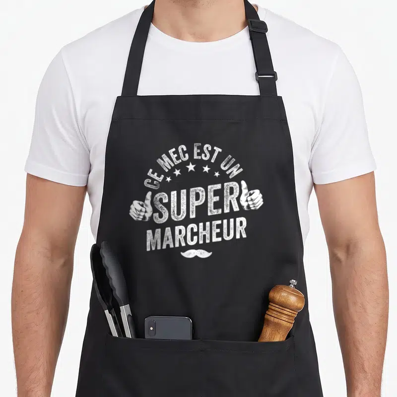 Tablier de cuisine noir avec inscription Ce mec est un super marcheur et deux pouces levés.