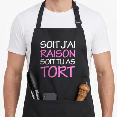 Tablier de cuisine noir avec l'inscription Soit j'ai raison soit tu as tort en rose et blanc.