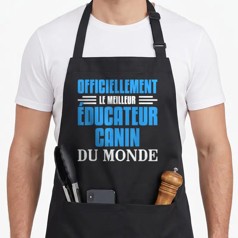 Tablier de cuisine noir avec inscription bleue et blanche reconnu comme le meilleur éducateur canin du monde
