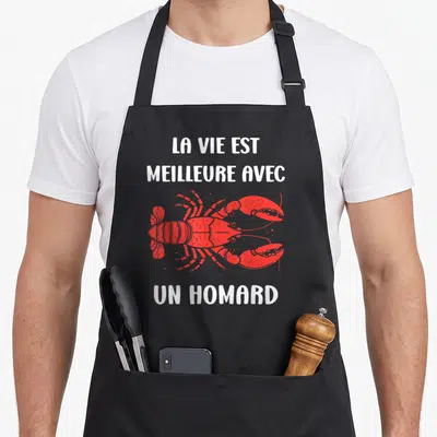 Tablier de cuisine noir avec illustration d'un homard rouge et texte blanc La vie est meilleure avec un homard.