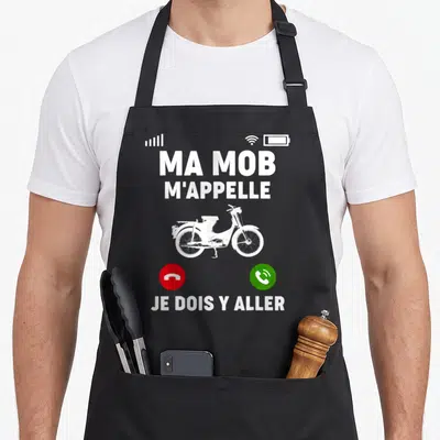 Tablier de cuisine noir avec inscription Ma Mob M'Appelle et illustration blanche de mobylette classique au centre.