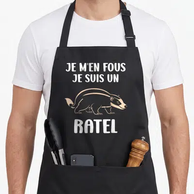 Tablier de cuisine noir avec illustration de ratel et texte blanc Je m'en fous je suis un ratel
