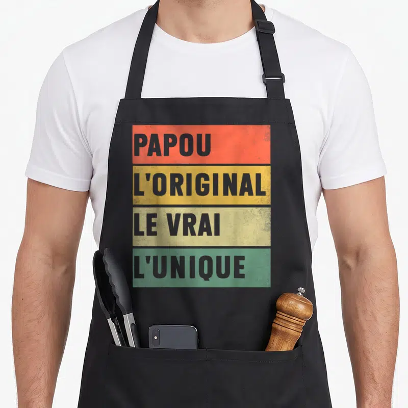 Tablier de cuisine noir avec bandes colorées et texte gris Papou l'original le vrai l'unique