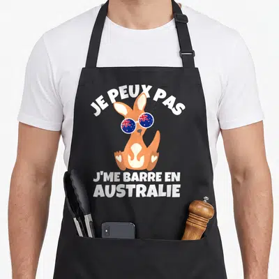 Tablier de cuisine noir avec un kangouron portant des lunettes au drapeau australien et du texte humoristique blanc.
