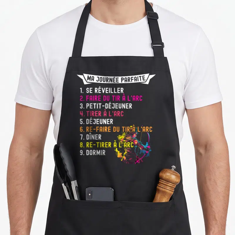 Tablier de cuisine noir avec liste Ma Journée Parfaite et silhouette d'archère aux couleurs vives.