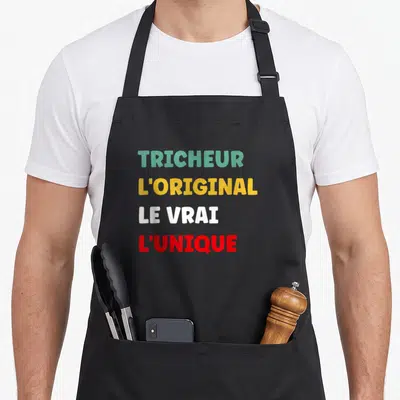 Tablier de cuisine noir avec inscription tricheur l'original le vrai l'unique en couleurs vives.