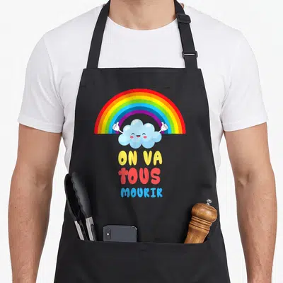 Tablier de cuisine noir avec nuage souriant, arc-en-ciel et texte on va tous mourik en couleurs vives.