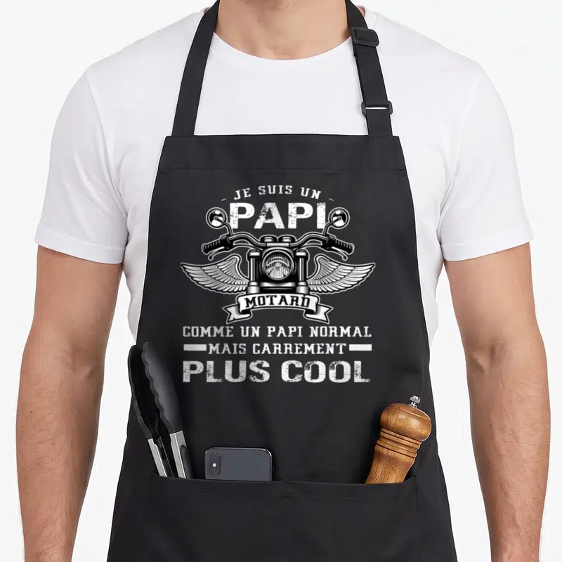 Tablier de cuisine noir avec illustration de phare de moto, ailes et texte Je suis un papi motard plus cool.