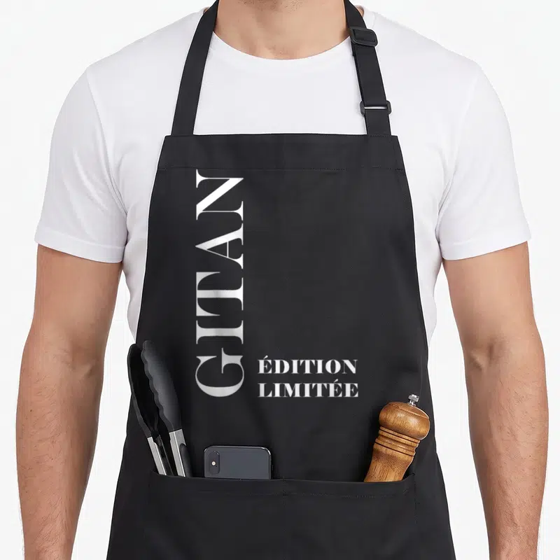 Tablier de cuisine noir avec inscription verticale Gitan et « Édition Limitée » en lettres blanches élégantes.