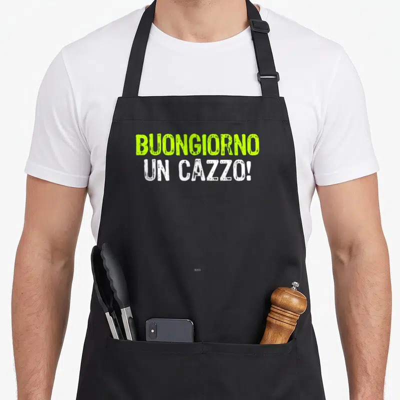 Tablier de cuisine noir avec l'inscription Buongiorno Un Cazzo en typographie verte et blanche texturée.