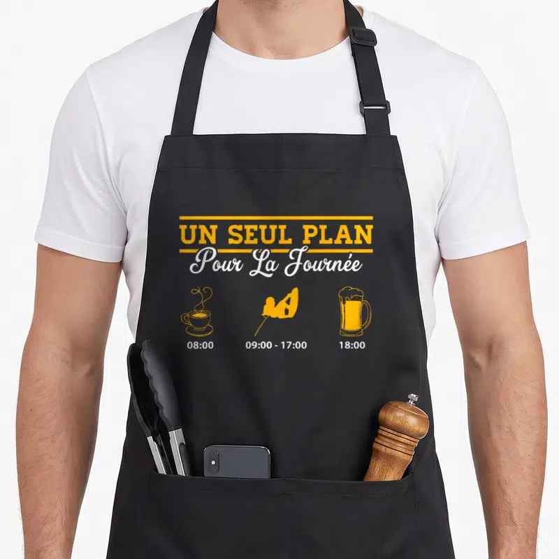 Tablier de cuisine noir avec illustration schedule Un seul plan pour la journée café wakeboard bière en orange et blanc.