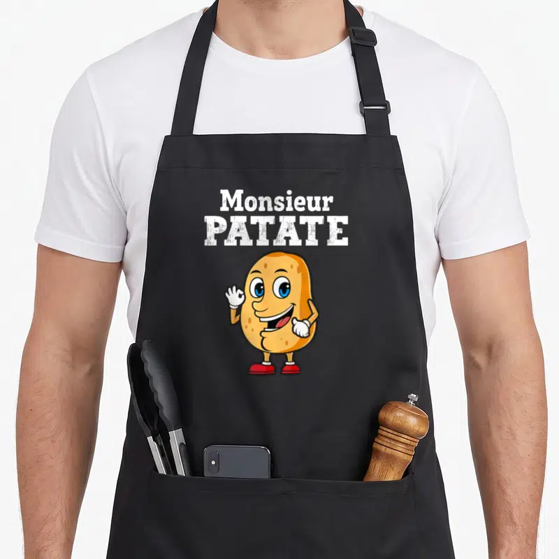 Tablier de cuisine noir avec illustration d'une pomme de terre souriante et texte Monsieur Patate en blanc.