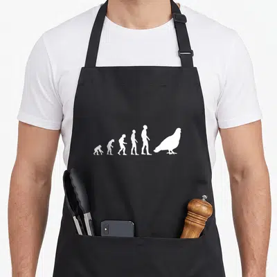 Tablier de cuisine noir avec une illustration blanche représentant l'évolution humaine se terminant par un pigeon.