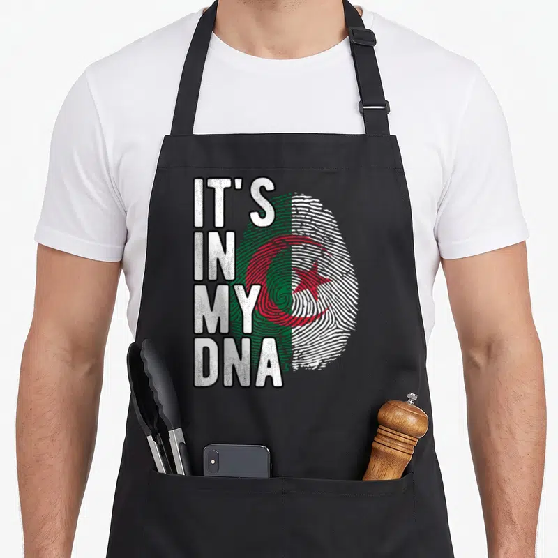 Tablier de cuisine noir avec inscription It's in my DNA et drapeau Algérie en empreinte digitale verte rouge et blanche.